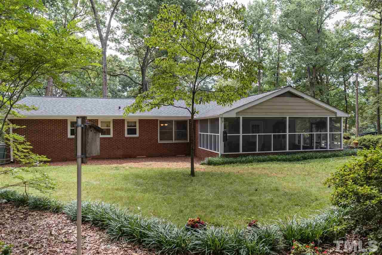6405 Johnsdale Road Raleigh, NC 27615 - Photo 20 of 25 a front view of a house with a yard