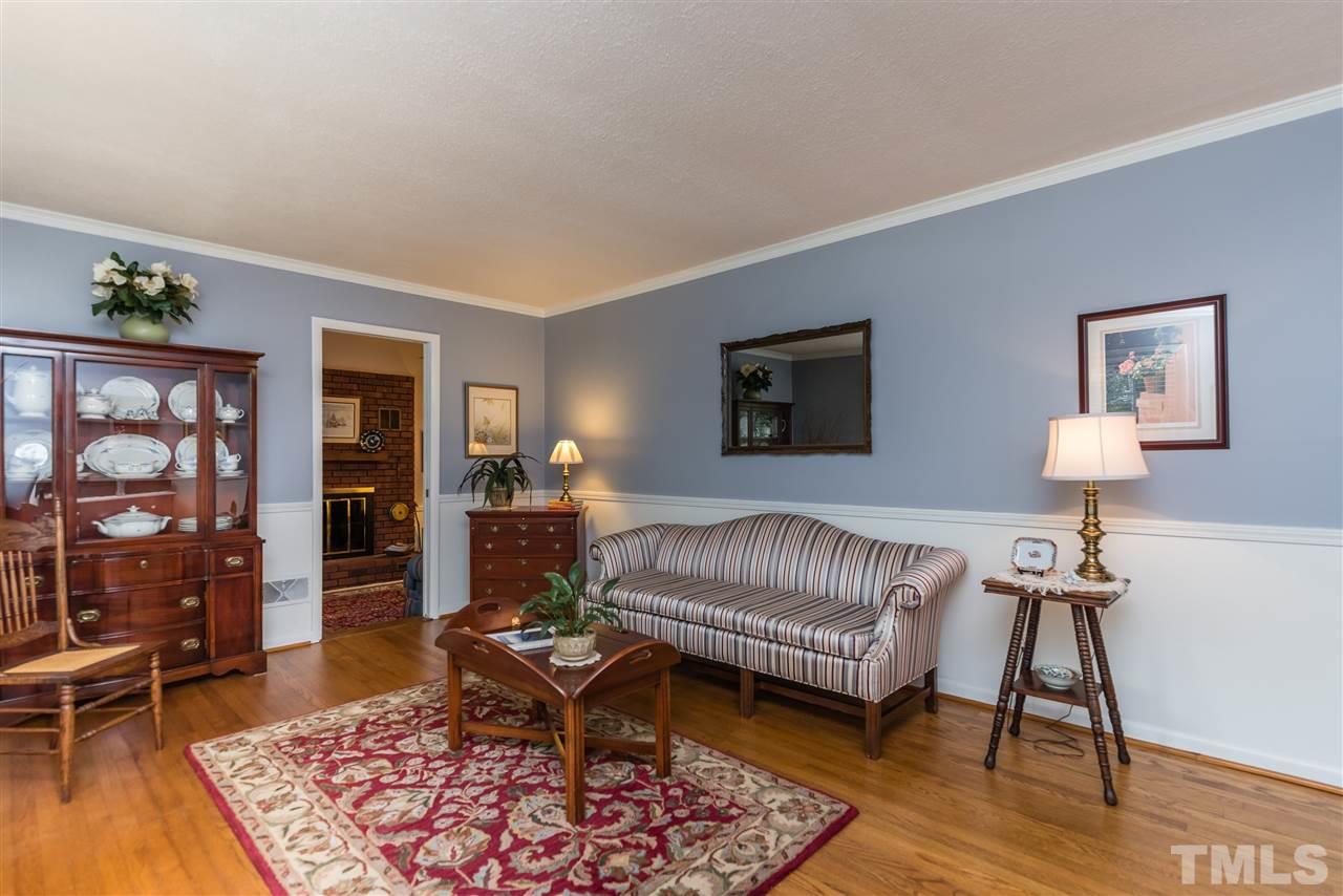 6405 Johnsdale Road Raleigh, NC 27615 - Photo 3 of 25 a living room with furniture and wooden floor