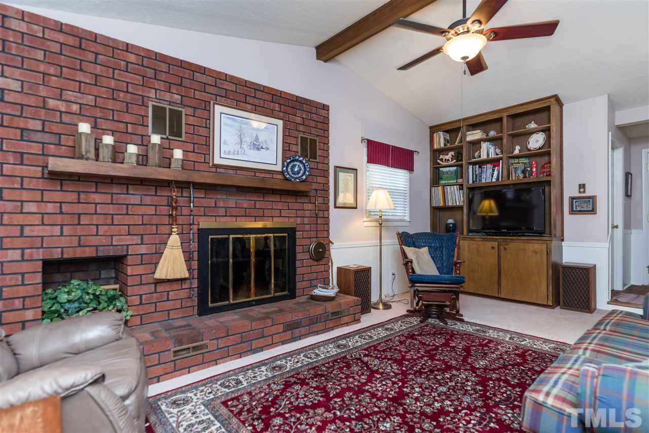 6405 Johnsdale Road Raleigh, NC 27615 - Photo 5 of 25 a living room with furniture and a fireplace