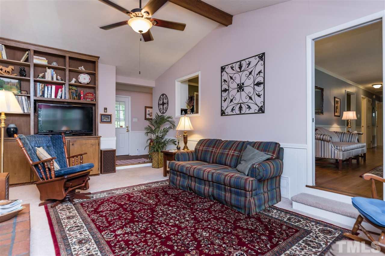 6405 Johnsdale Road Raleigh, NC 27615 - Photo 6 of 25 a living room with furniture and a flat screen tv