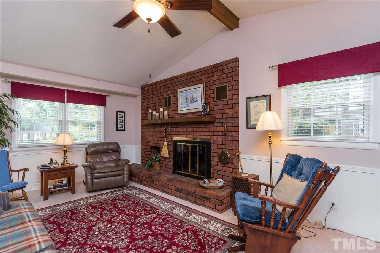 6405 Johnsdale Road Raleigh, NC 27615 - Photo 7 of 25 a living room with furniture and a fireplace