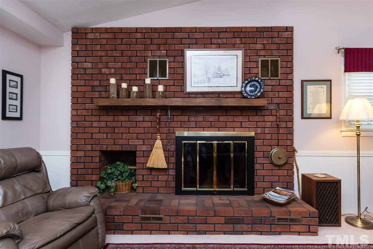 6405 Johnsdale Road Raleigh, NC 27615 - Photo 8 of 25 a living room with furniture and a fireplace
