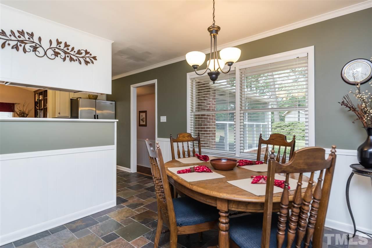 6405 Johnsdale Road Raleigh, NC 27615 - Photo 9 of 25 a view of a dining room with furniture window and outside view