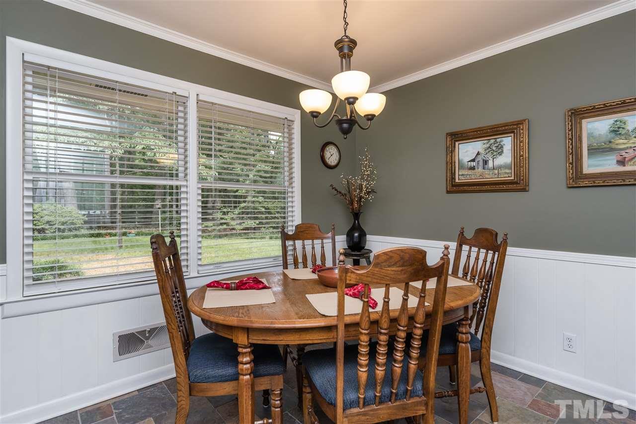 6405 Johnsdale Road Raleigh, NC 27615 - Photo 10 of 25 a view of a dining room with furniture window and outside view