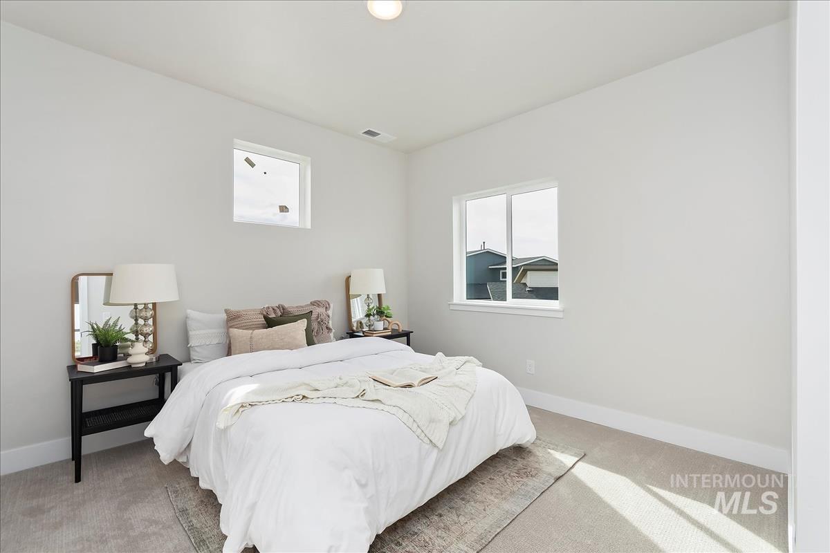 2829 West Warlander Street Meridian, ID 83642 - Photo 25 of 32 Carpeted bedroom with baseboards