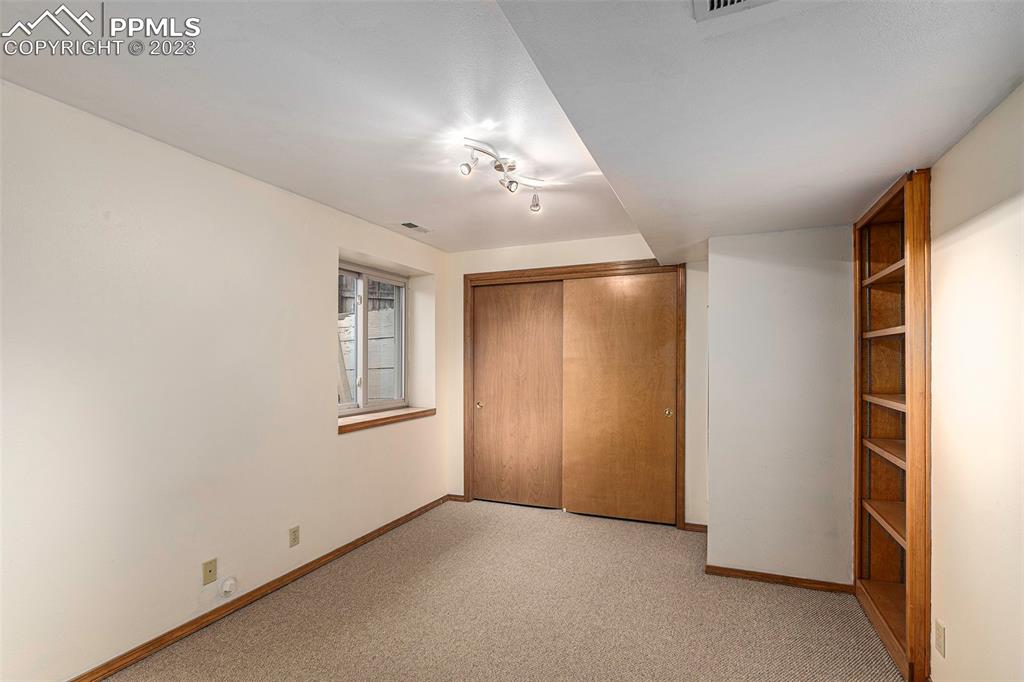 9054 Estebury Circle Colorado Springs, CO 80920 - Photo 18 of 26 an empty room with windows and closet