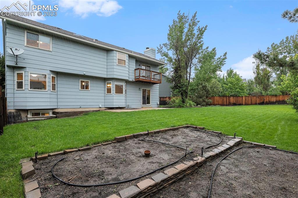 9054 Estebury Circle Colorado Springs, CO 80920 - Photo 20 of 26 a view of a house with a backyard