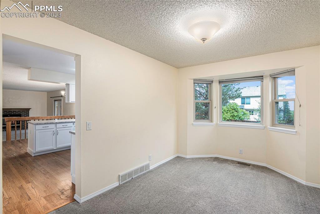 9054 Estebury Circle Colorado Springs, CO 80920 - Photo 6 of 26 a view of a hallway to kitchen and dining room