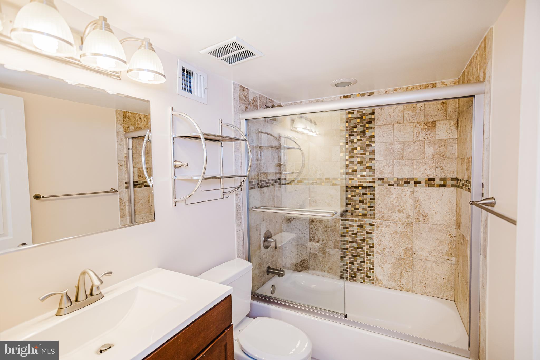 2177 Chain Bridge Road Vienna, VA 22182 - Photo 22 of 48 a bathroom with a sink toilet and shower