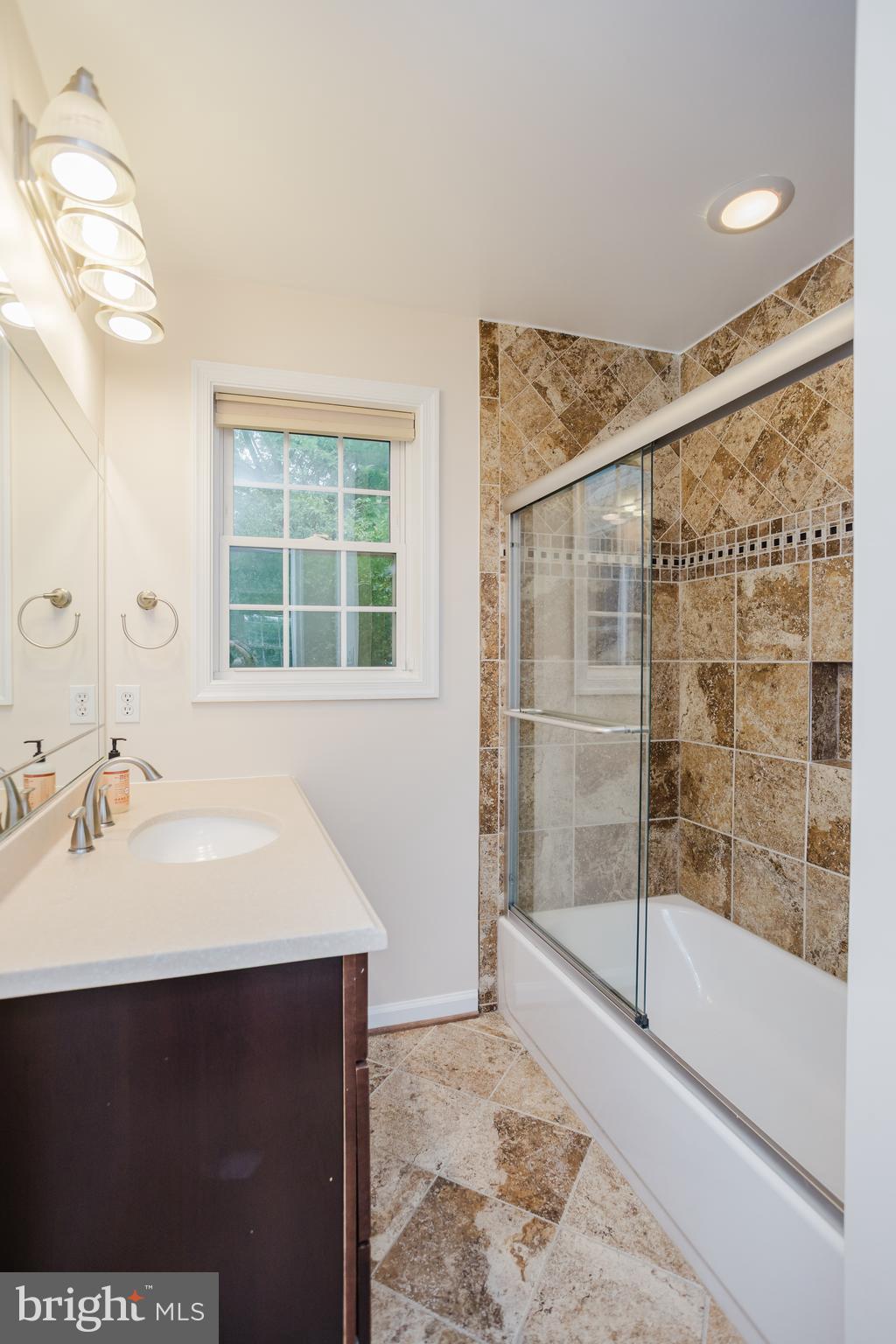 2177 Chain Bridge Road Vienna, VA 22182 - Photo 24 of 48 a bathroom with a sink and a mirror