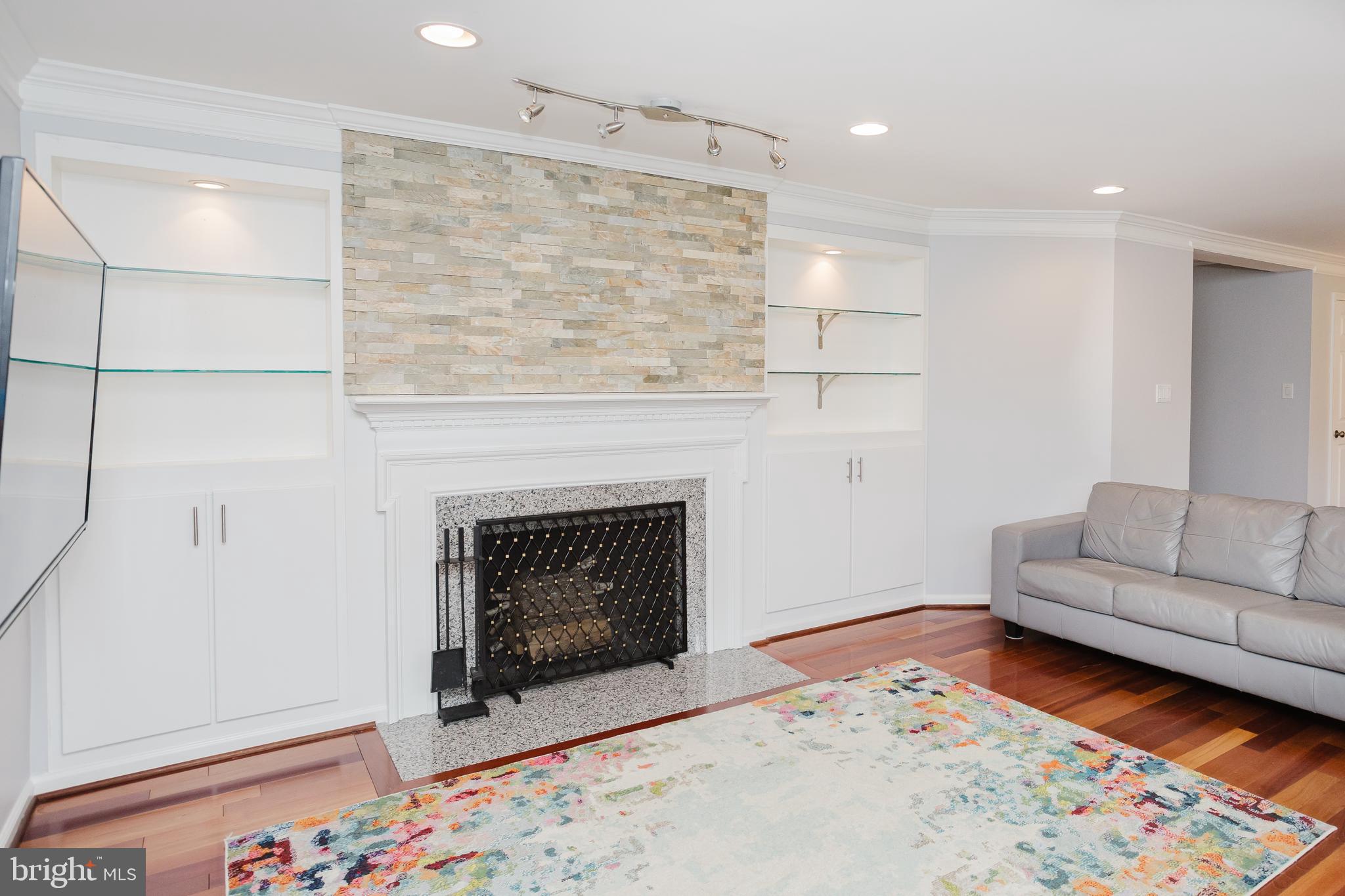 2177 Chain Bridge Road Vienna, VA 22182 - Photo 26 of 48 a living room with furniture and a fireplace