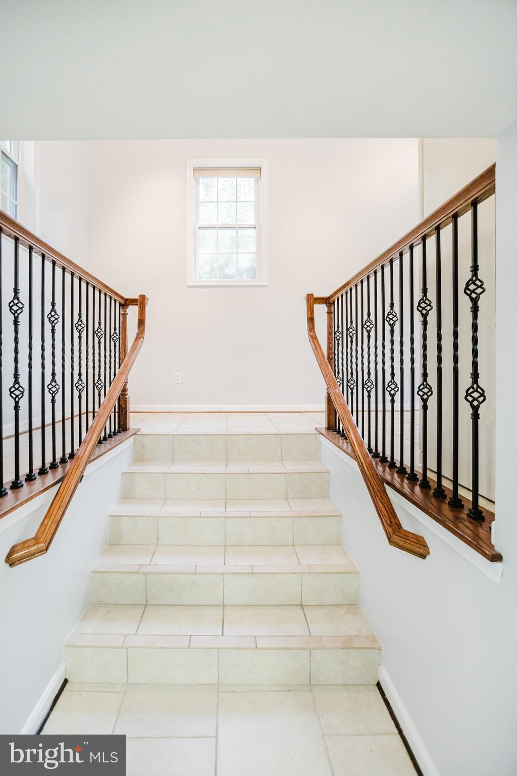 2177 Chain Bridge Road Vienna, VA 22182 - Photo 28 of 48 a view of staircase with white walls and a window