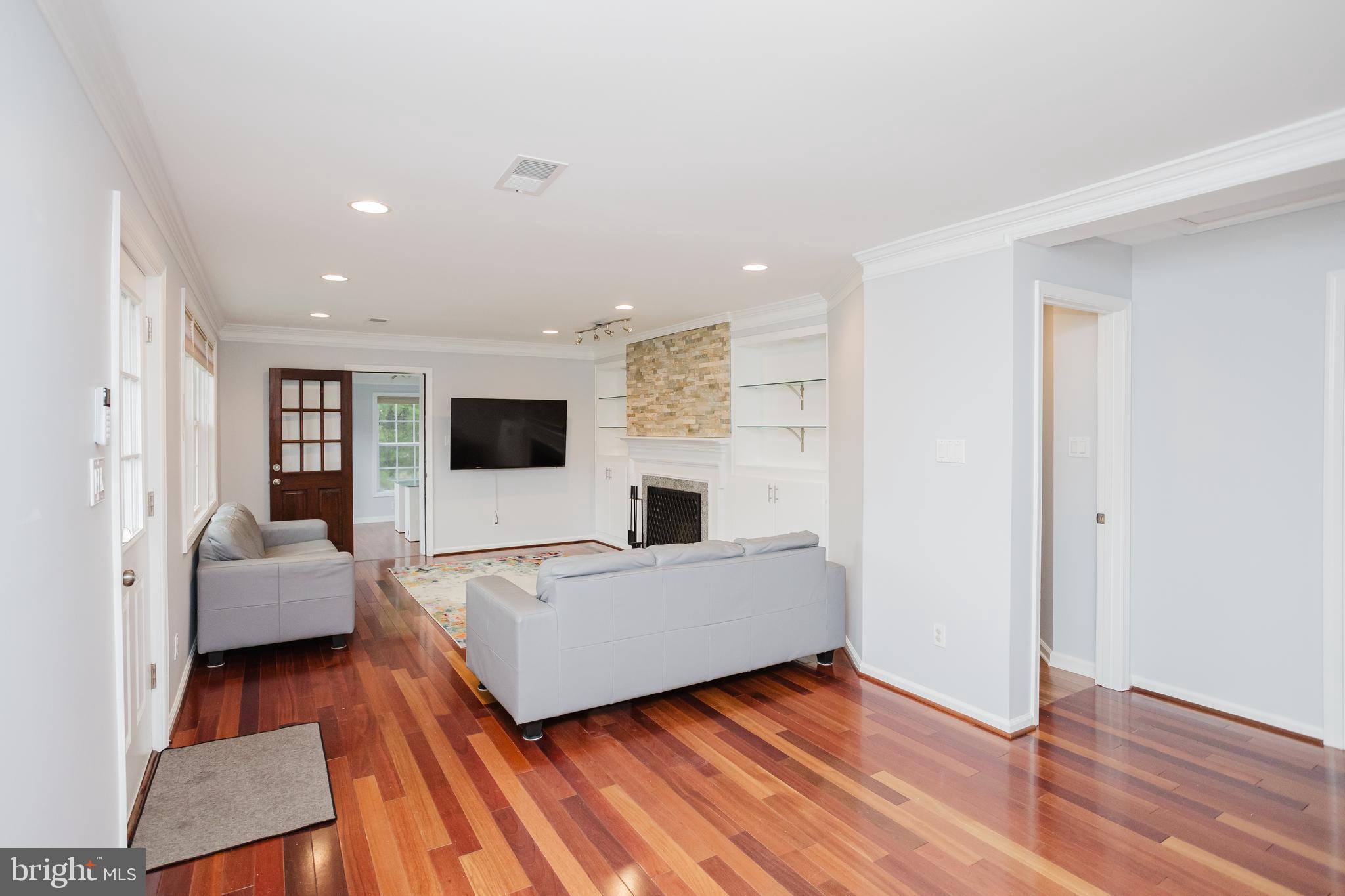 2177 Chain Bridge Road Vienna, VA 22182 - Photo 8 of 48 a living room with furniture and a flat screen tv
