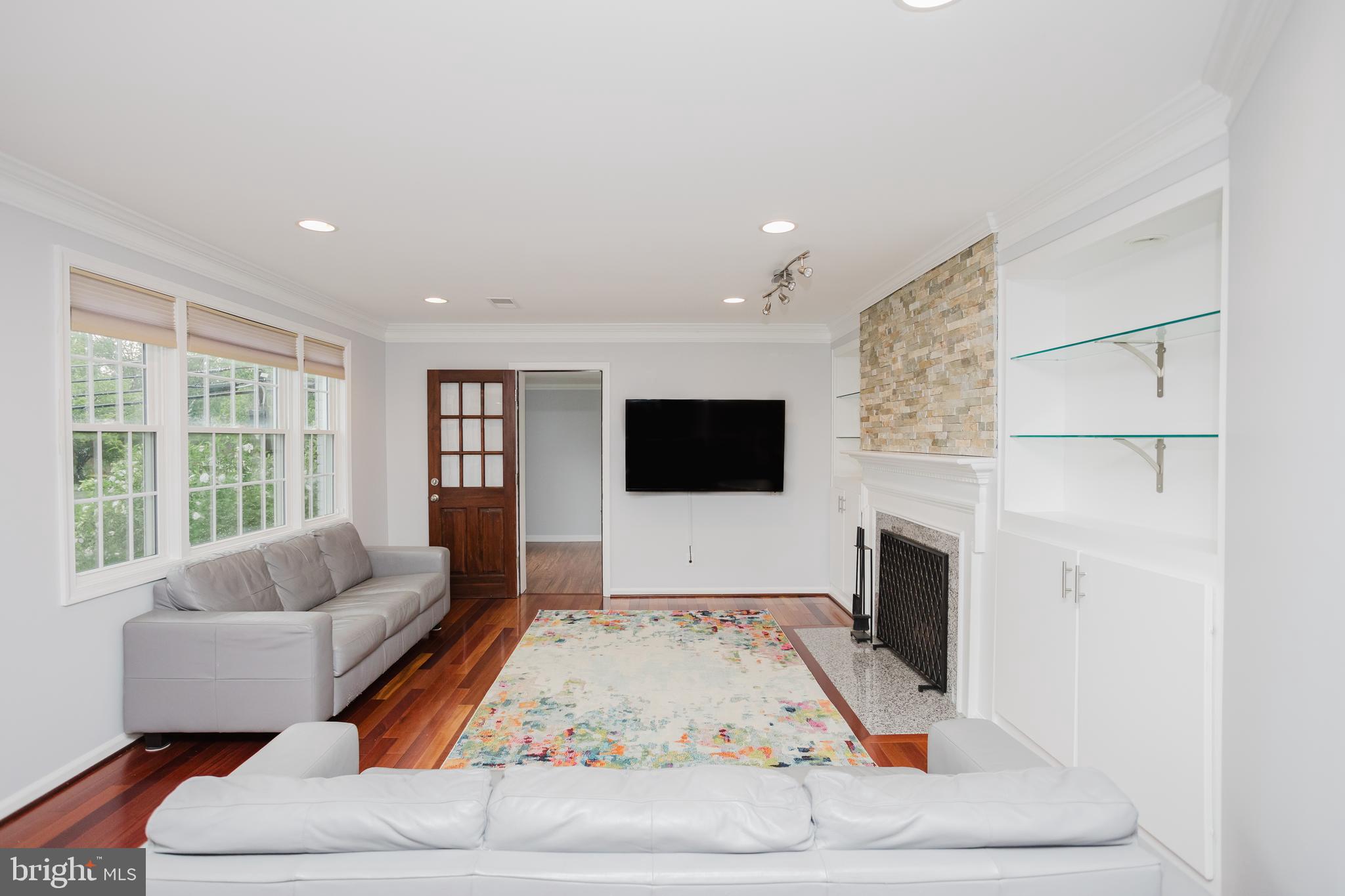 2177 Chain Bridge Road Vienna, VA 22182 - Photo 9 of 48 a living room with furniture and a flat screen tv