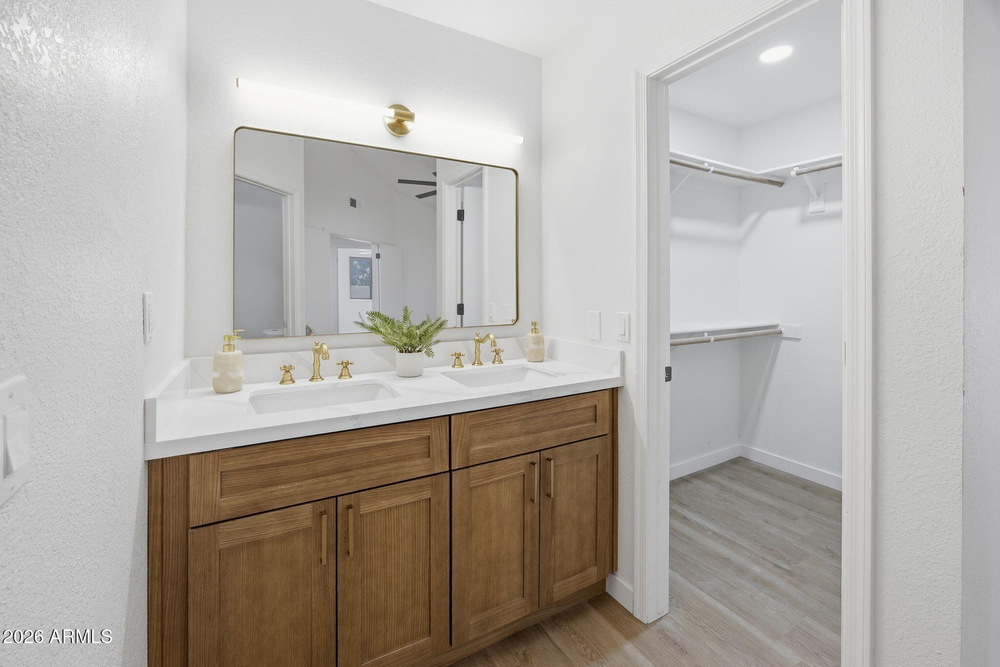 3134 East McKellips Road, Unit 69 Mesa, AZ 85213 - Photo 14 of 24 a bathroom with a sink and a mirror