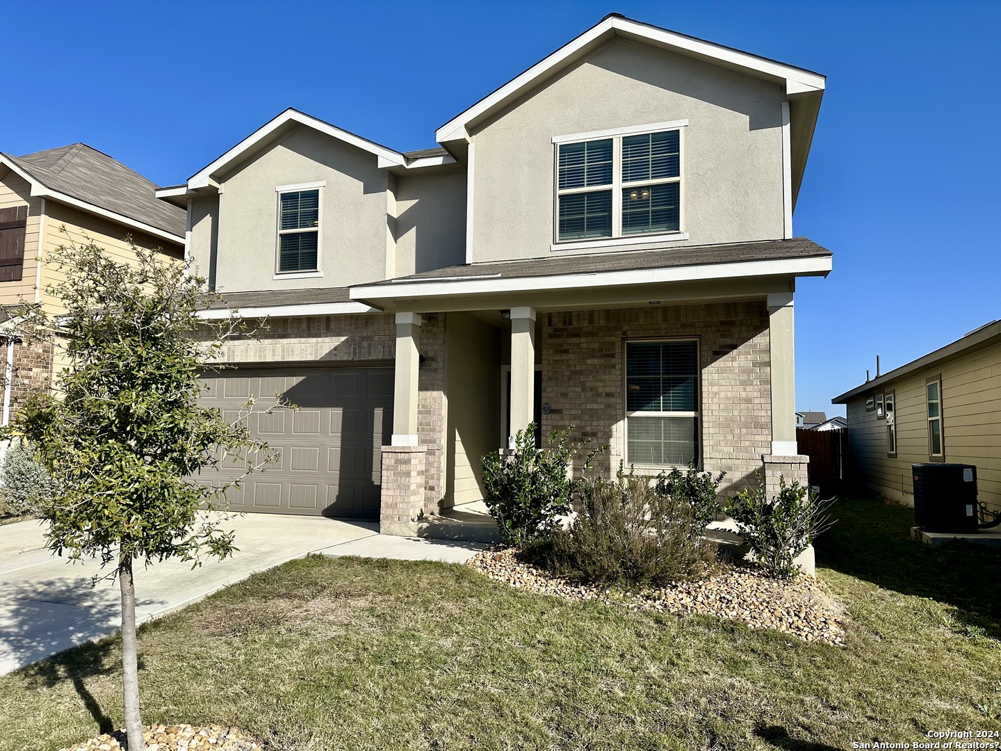 8907 Portobello Converse, TX 78109 - Photo 2 of 26 a front view of a house with a yard