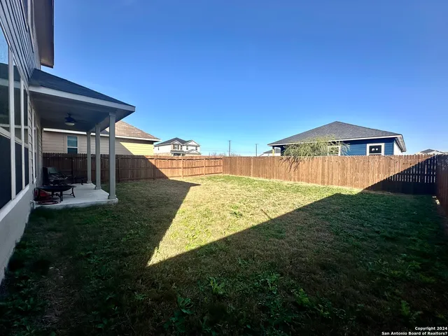 a view of a backyard with a garden and plants