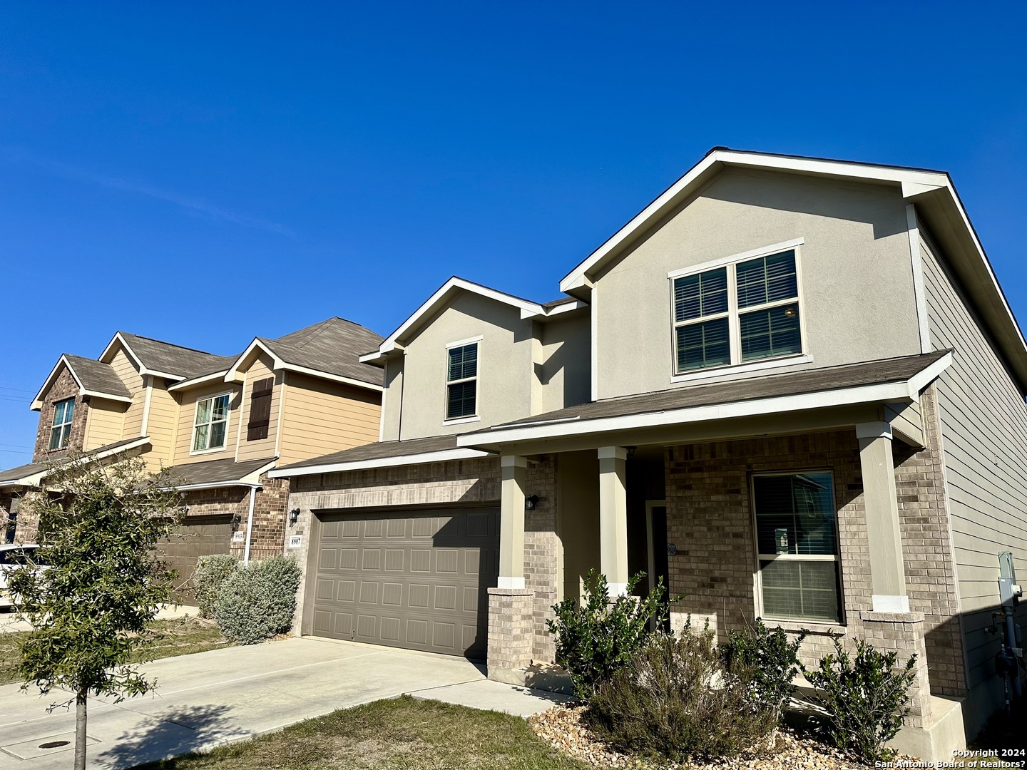 8907 Portobello Converse, TX 78109 - Photo 3 of 26 a front view of a house with a yard