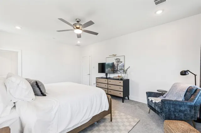 a bedroom with a bed and furniture