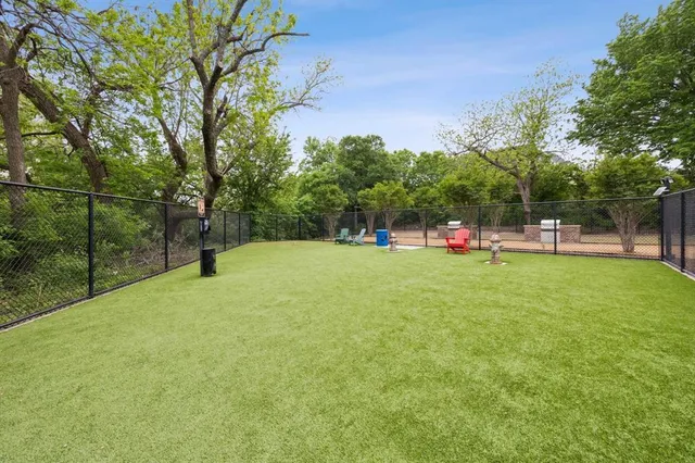 a view of outdoor space with playground and green space