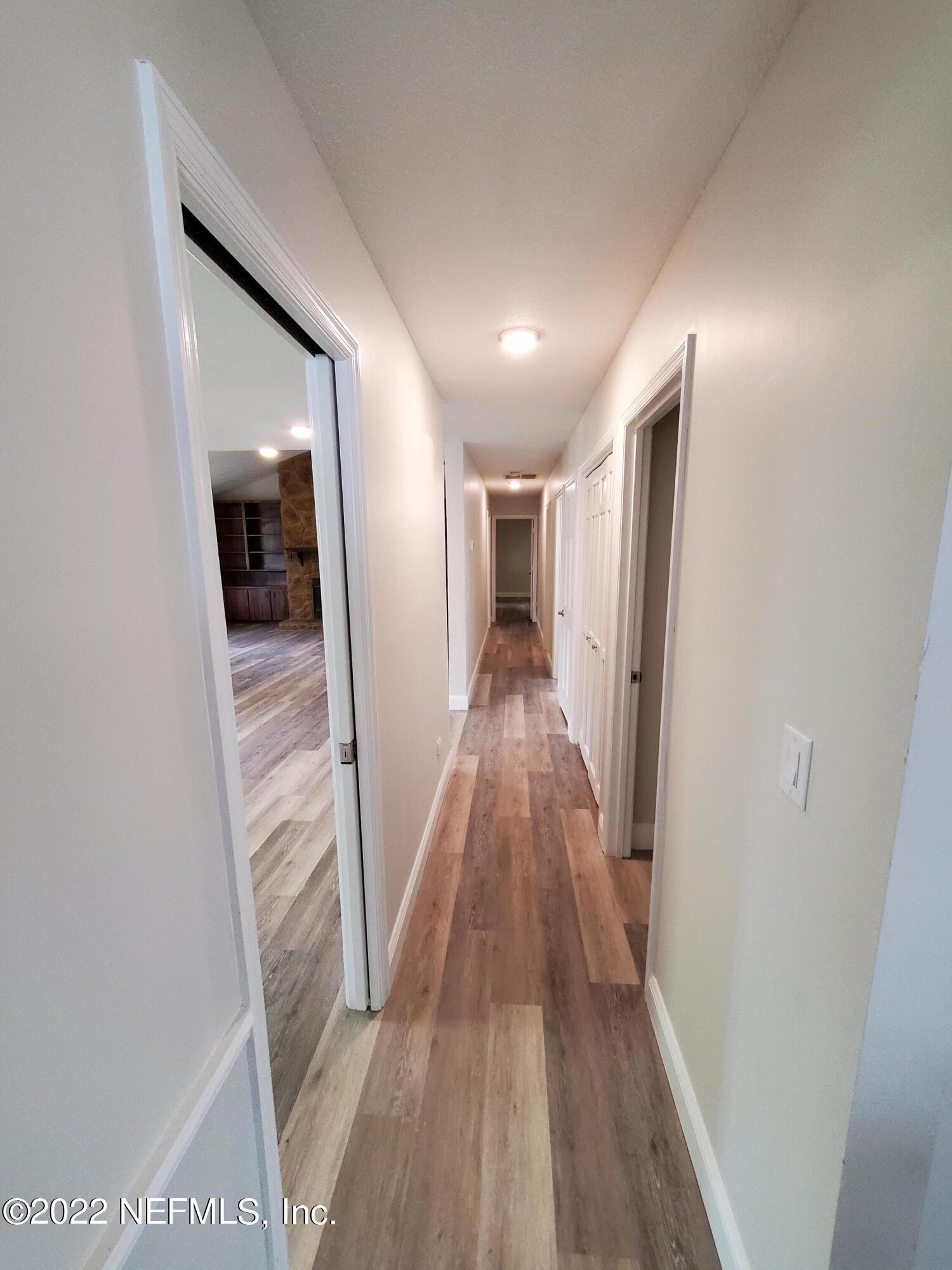 111 Nautilus Road St. Augustine, FL 32086 - Photo 16 of 35 a view of a hallway with wooden floor