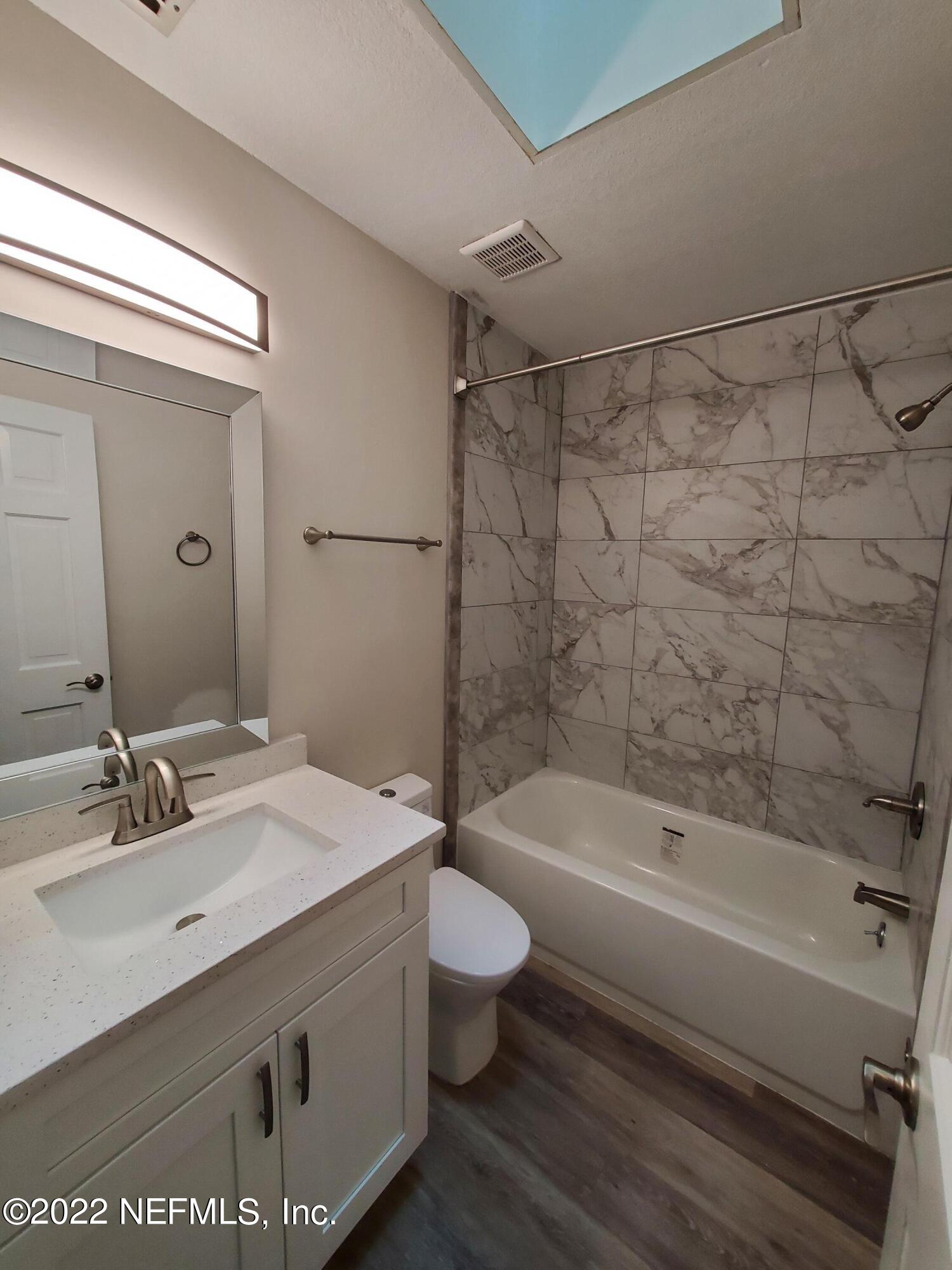 111 Nautilus Road St. Augustine, FL 32086 - Photo 18 of 35 a bathroom with a sink a toilet and shower