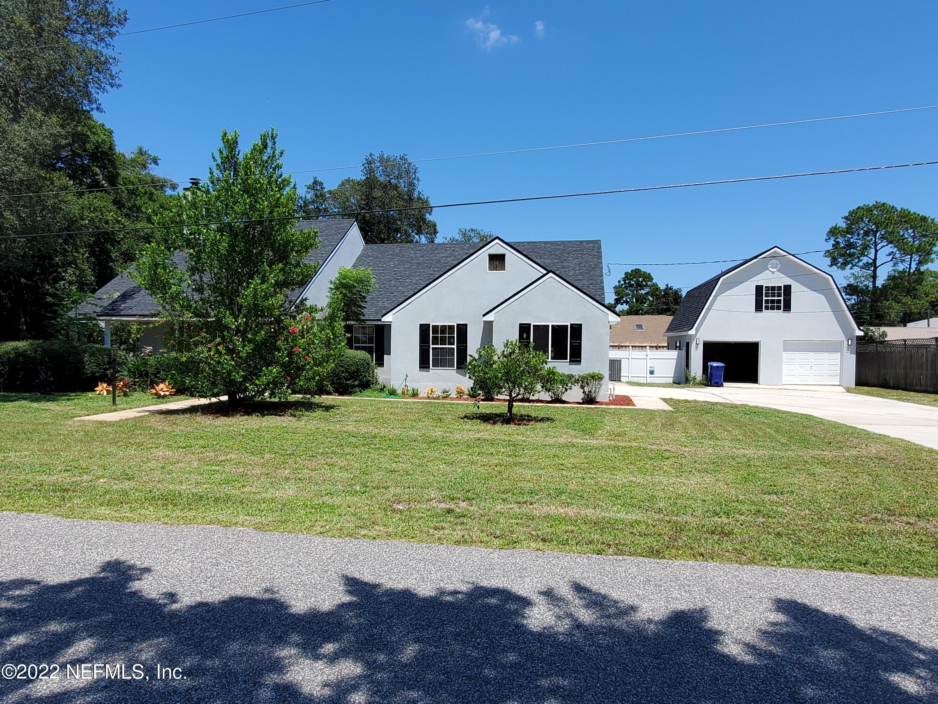 111 Nautilus Road St. Augustine, FL 32086 - Photo 2 of 35 a front view of a house with a yard