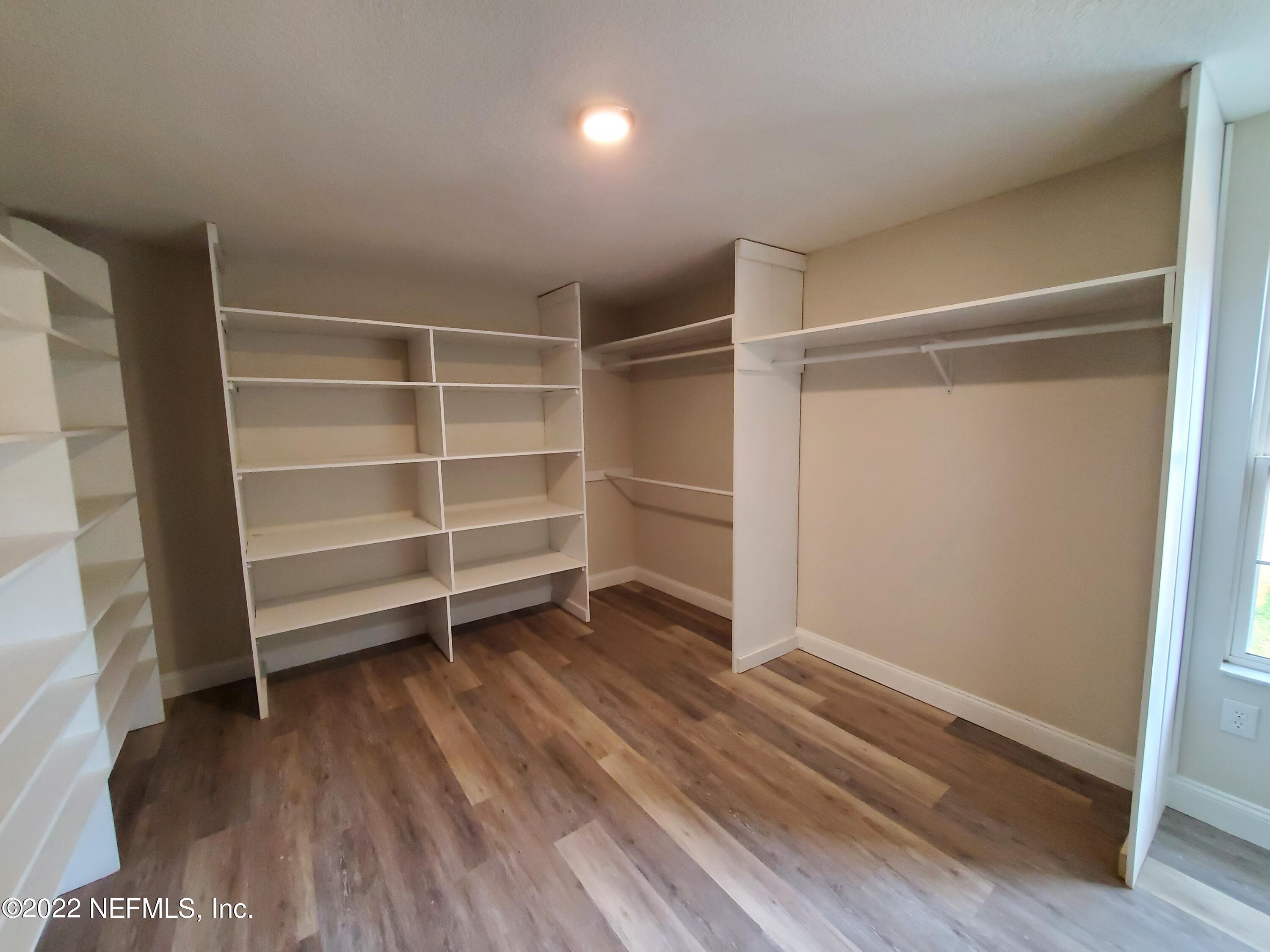 111 Nautilus Road St. Augustine, FL 32086 - Photo 21 of 35 a room with walk in closet and wooden floor