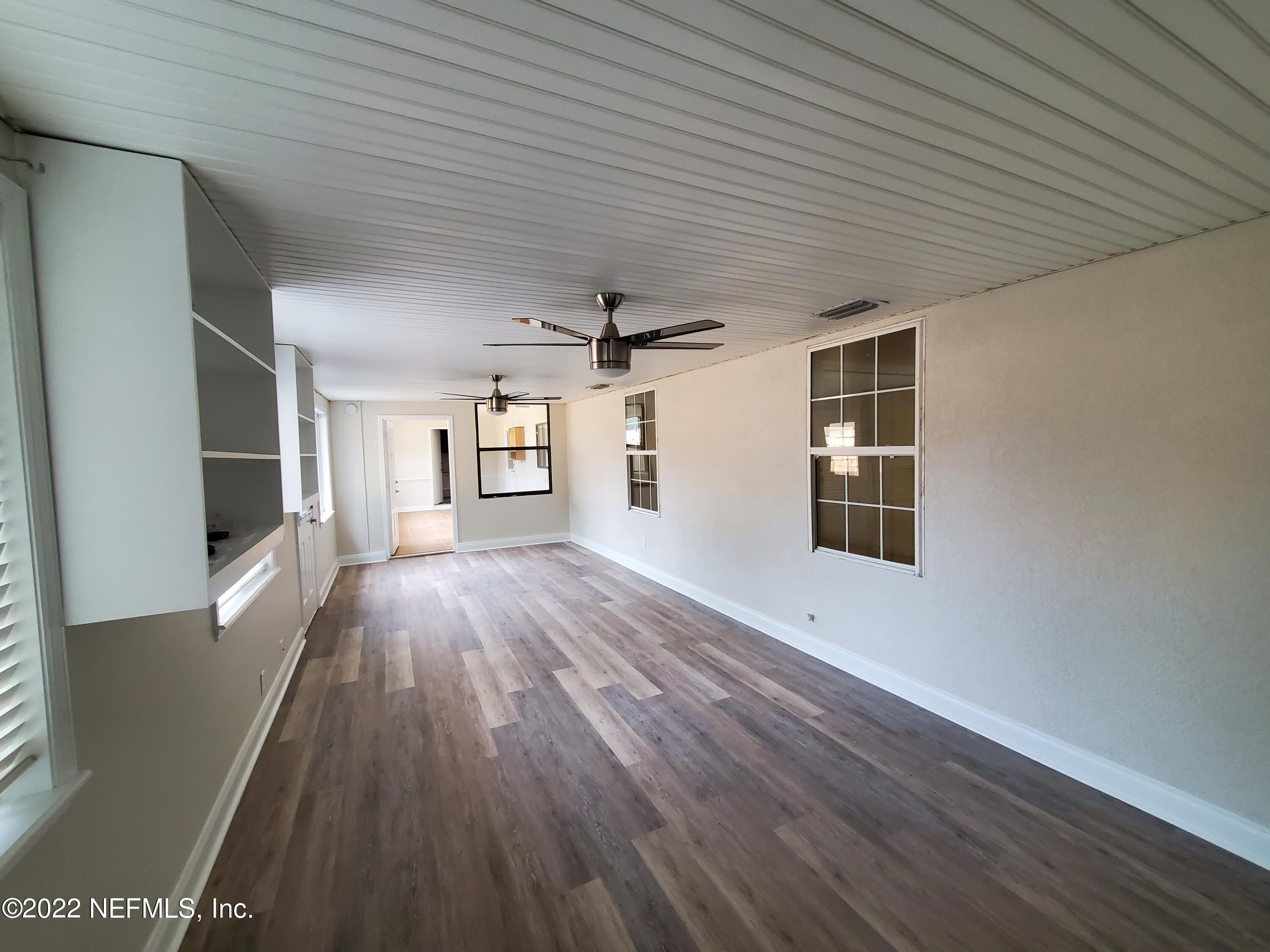 111 Nautilus Road St. Augustine, FL 32086 - Photo 26 of 35 wooden floor in an empty room with a window
