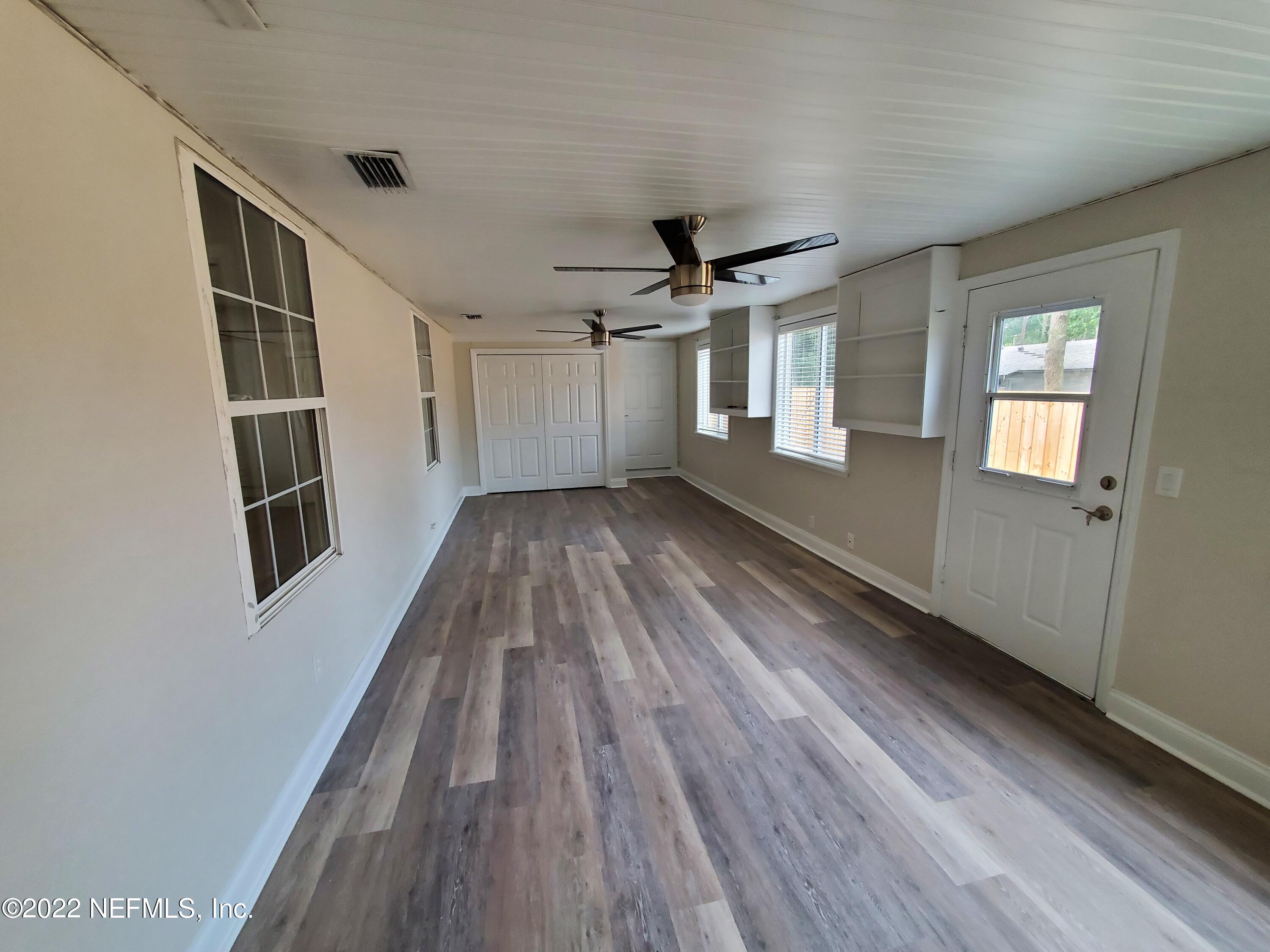 111 Nautilus Road St. Augustine, FL 32086 - Photo 27 of 35 wooden floor in an empty room with a window