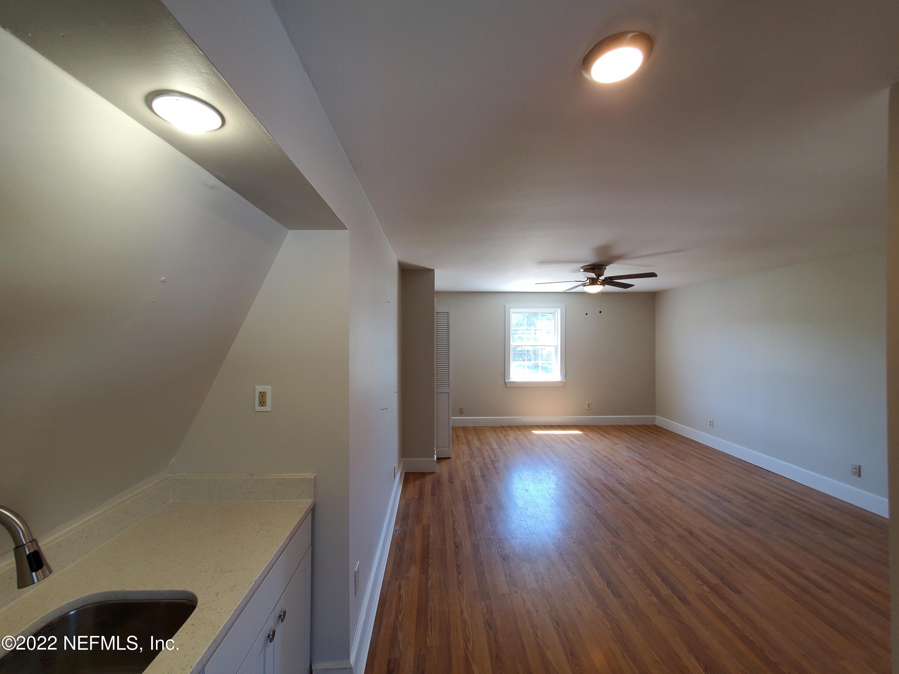 111 Nautilus Road St. Augustine, FL 32086 - Photo 33 of 35 wooden floor in an empty room with a window