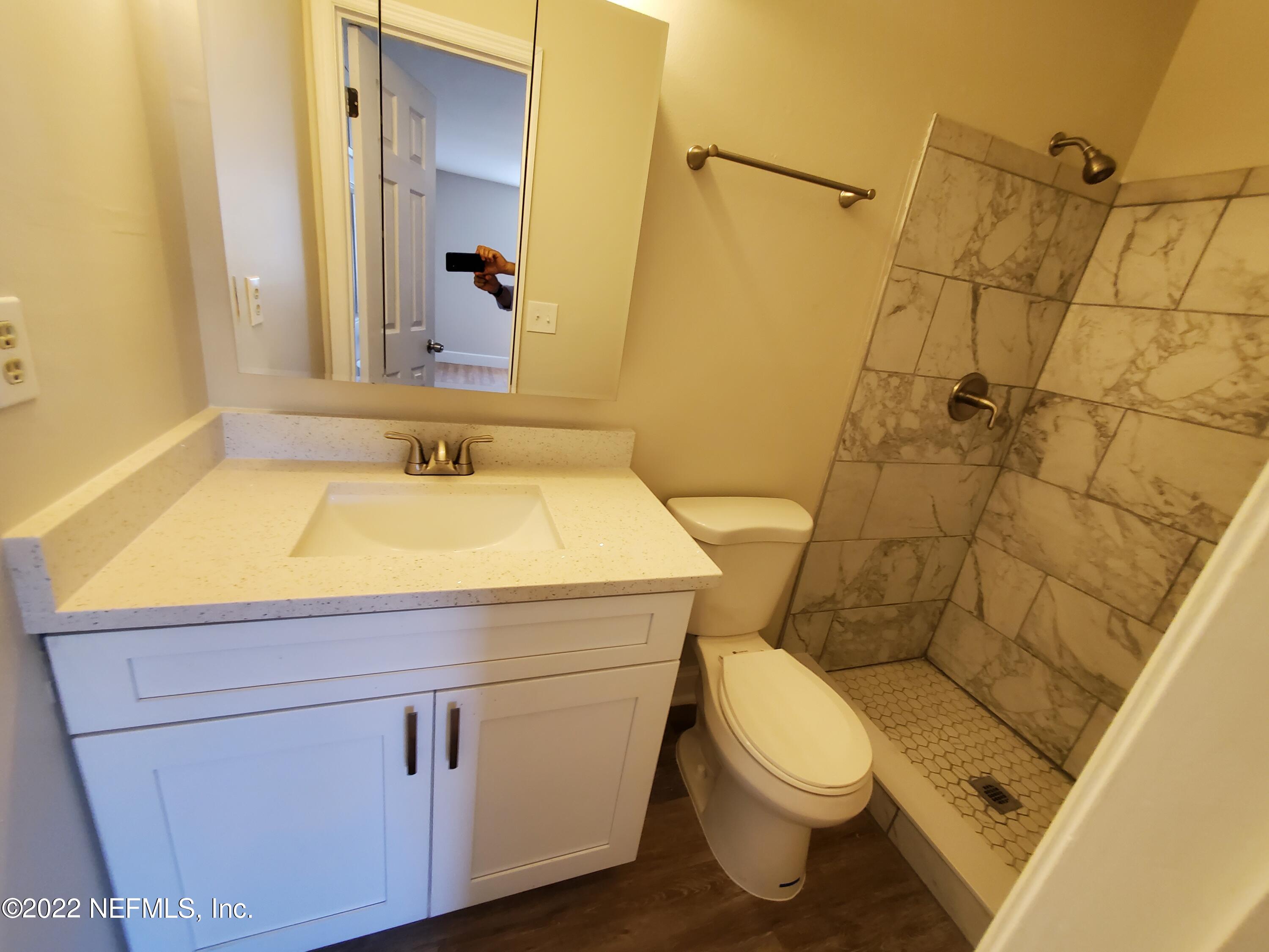 111 Nautilus Road St. Augustine, FL 32086 - Photo 35 of 35 a bathroom with a sink a toilet and shower