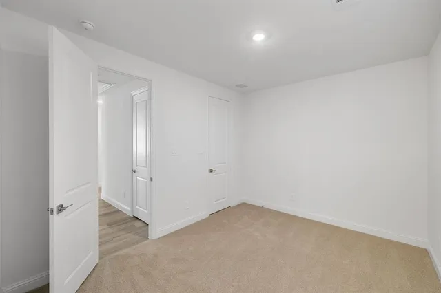 a bathroom with a granite countertop sink a toilet and shower