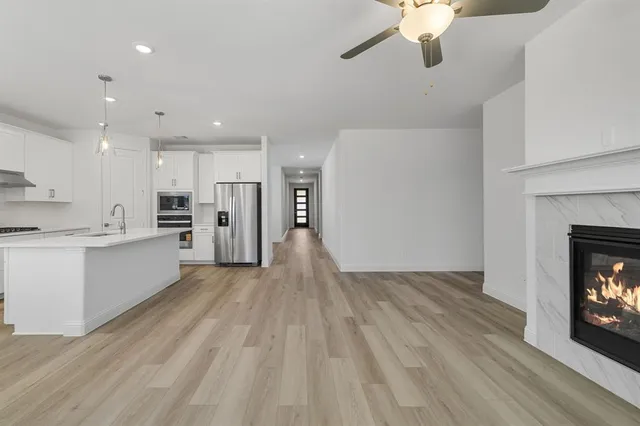 a view of an empty room with a fireplace