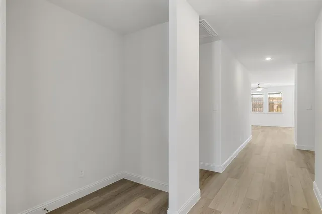 a view of storage and utility room with a door