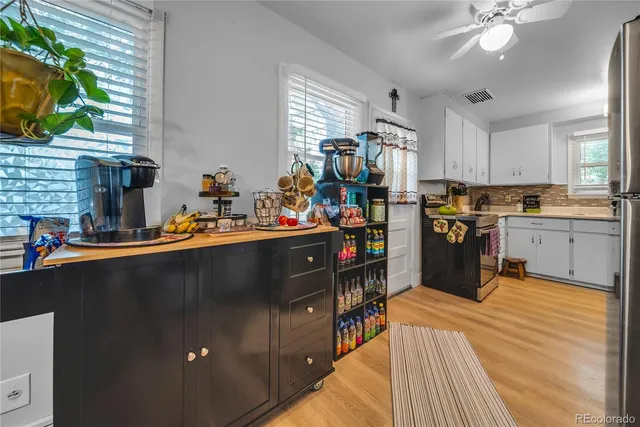 a kitchen with stainless steel appliances granite countertop a sink counter space cabinets and a window
