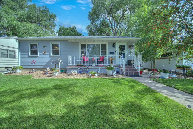 a house view with a seating space and garden