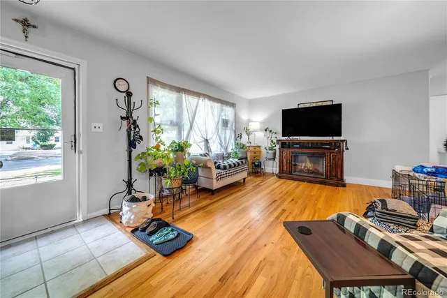 a living room with furniture fireplace and a flat screen tv