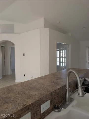 a view of a livingroom with a ceiling fan and window