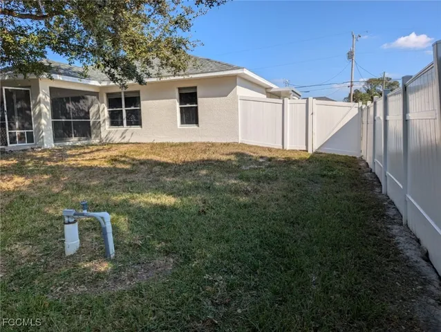 a backyard of a house with seating space