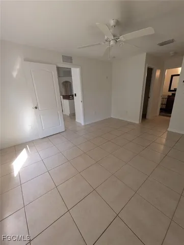 a view of a livingroom with a furniture and a ceiling fan