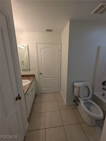 a bathroom with a sink toilet and vanity