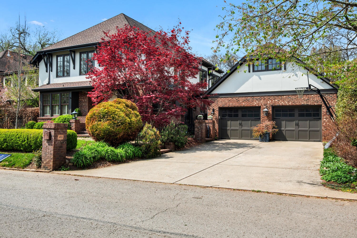 a front view of a house with a garden
