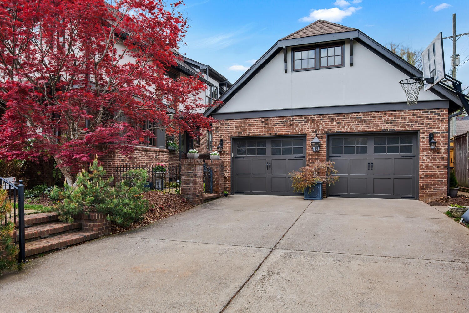 4018 Valley Road Nashville, TN 37205 - Photo 3 of 39 a front view of a house with a yard and garage