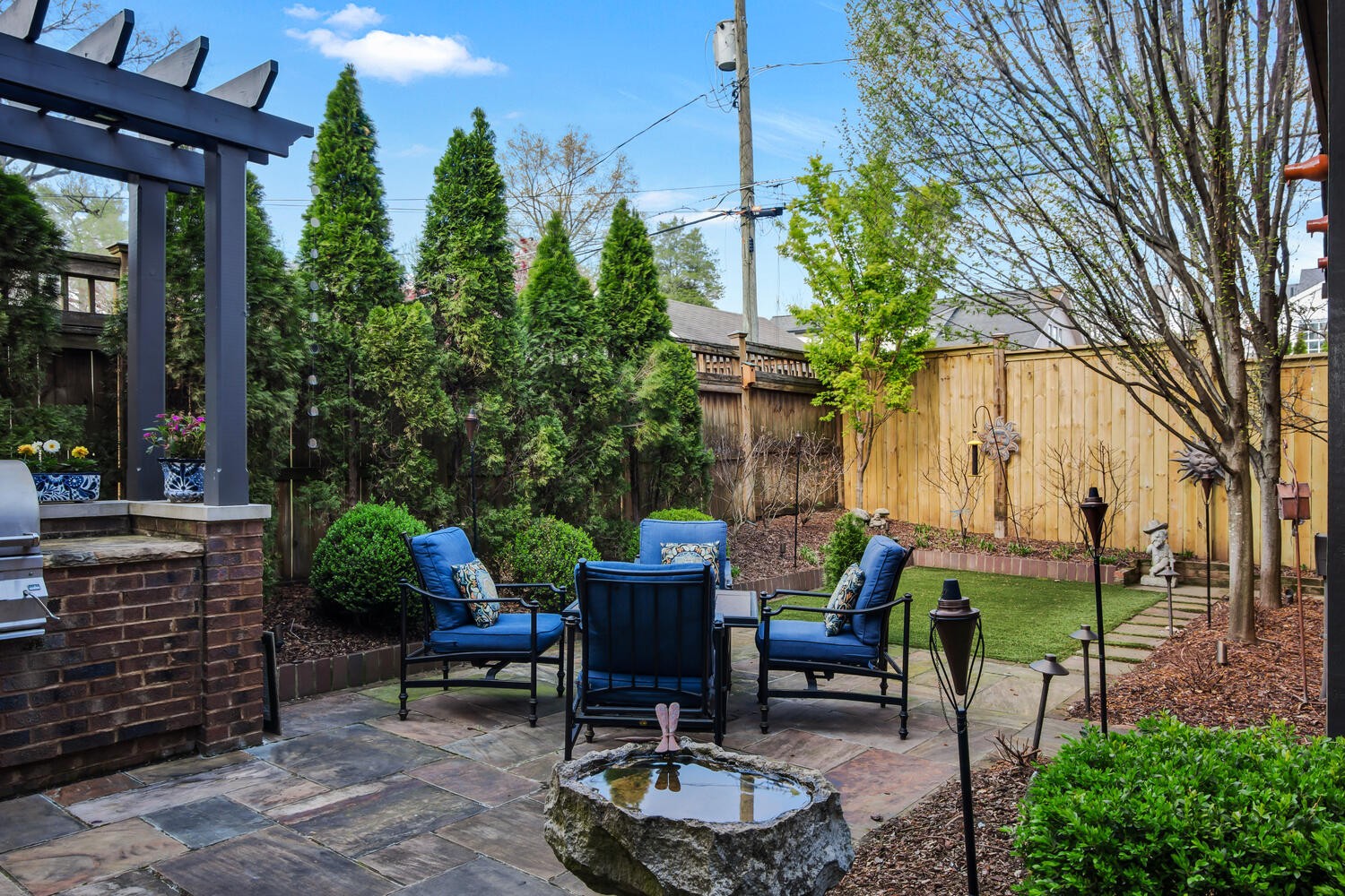 4018 Valley Road Nashville, TN 37205 - Photo 39 of 39 a view of a patio with table and chairs potted plants and a large tree