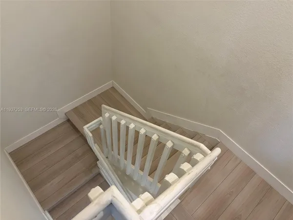 a view of staircase with white walls