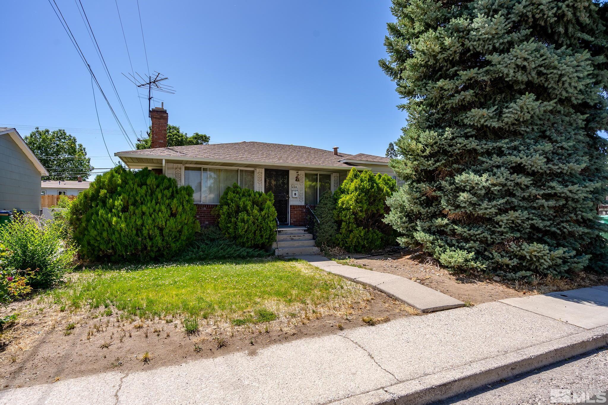 655 Belgrave Avenue Reno, NV 89502 - Photo 1 of 17 a front view of a house with a yard