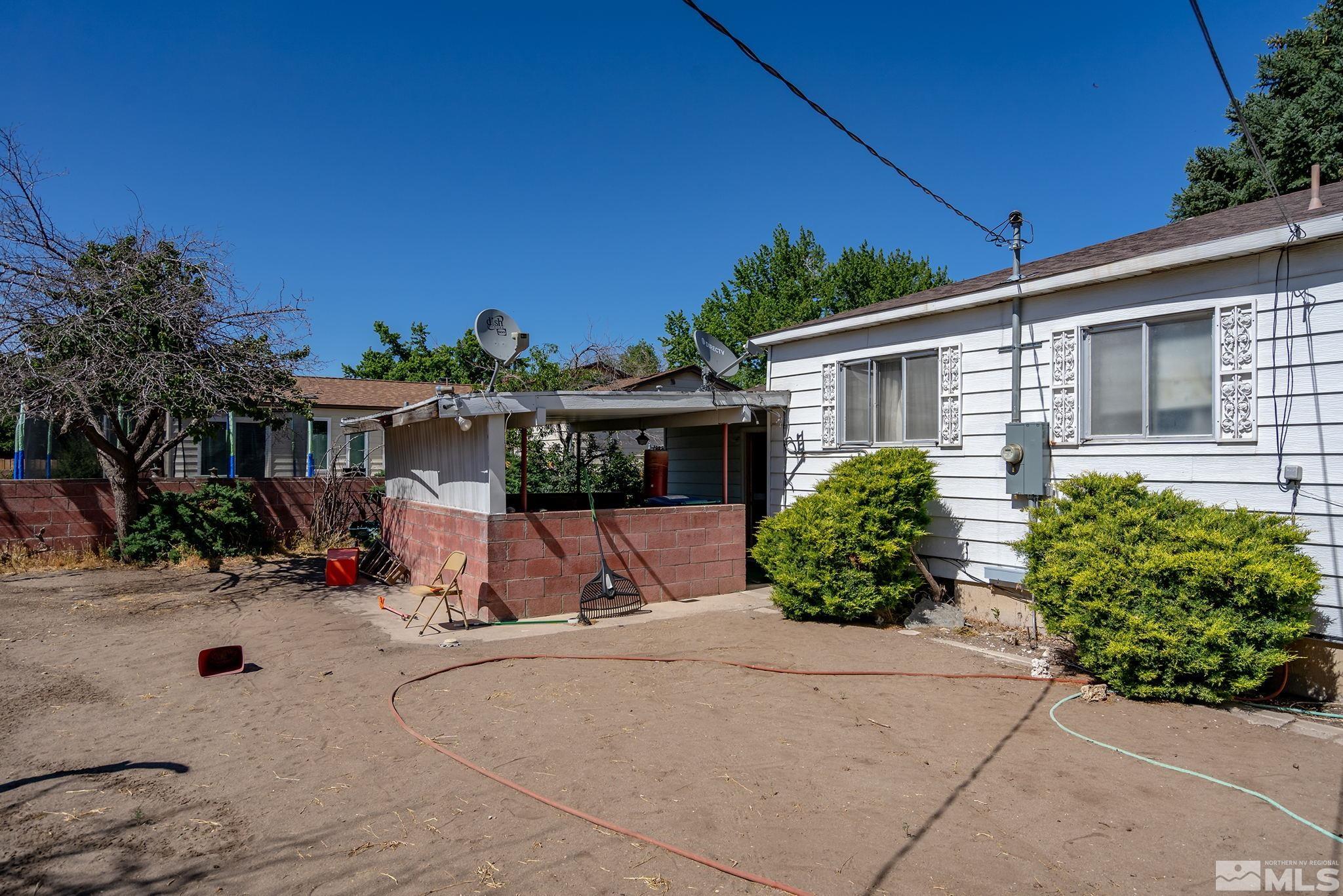 655 Belgrave Avenue Reno, NV 89502 - Photo 15 of 17 front view of a house with a yard