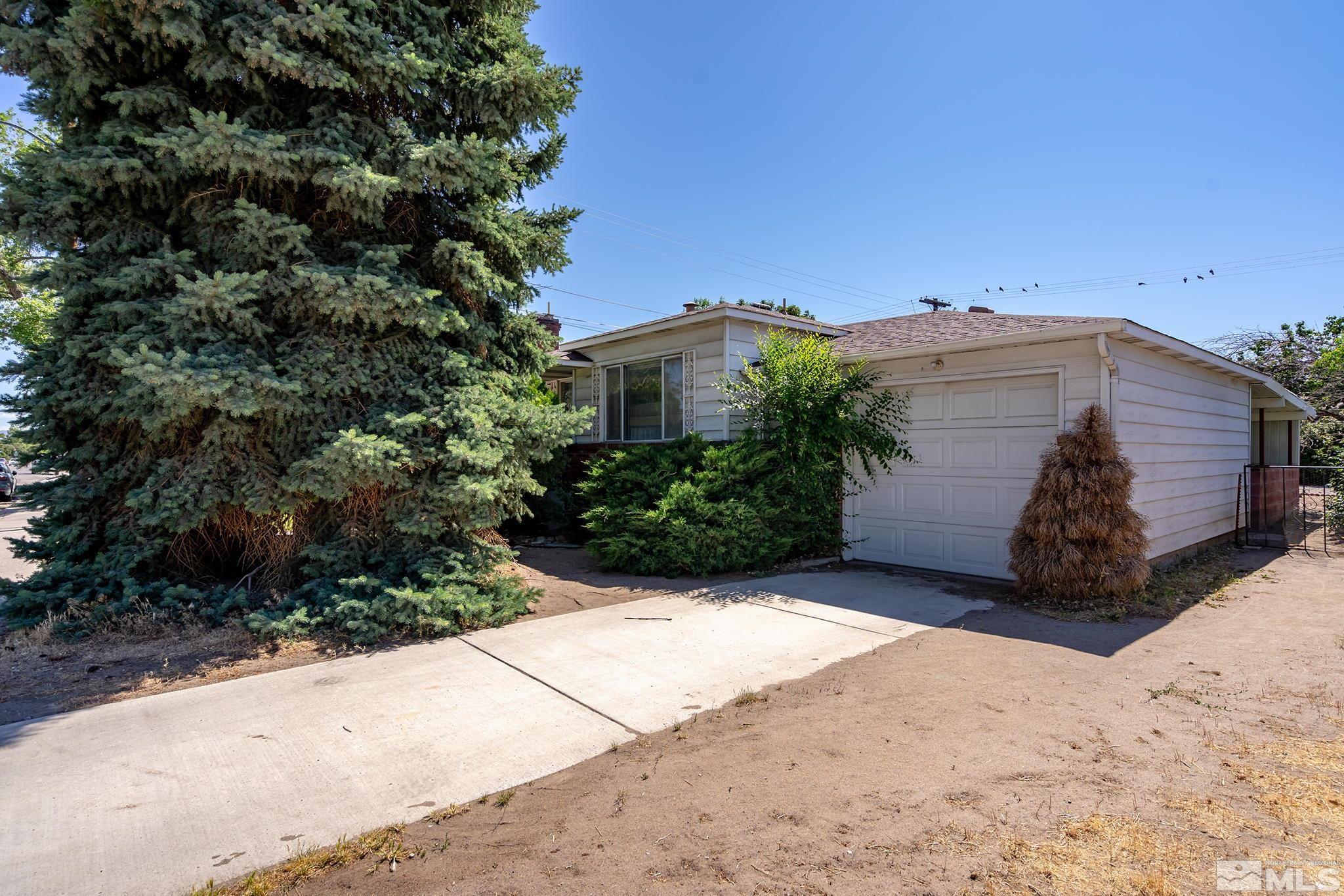 655 Belgrave Avenue Reno, NV 89502 - Photo 2 of 17 a view of a house with a yard and plant