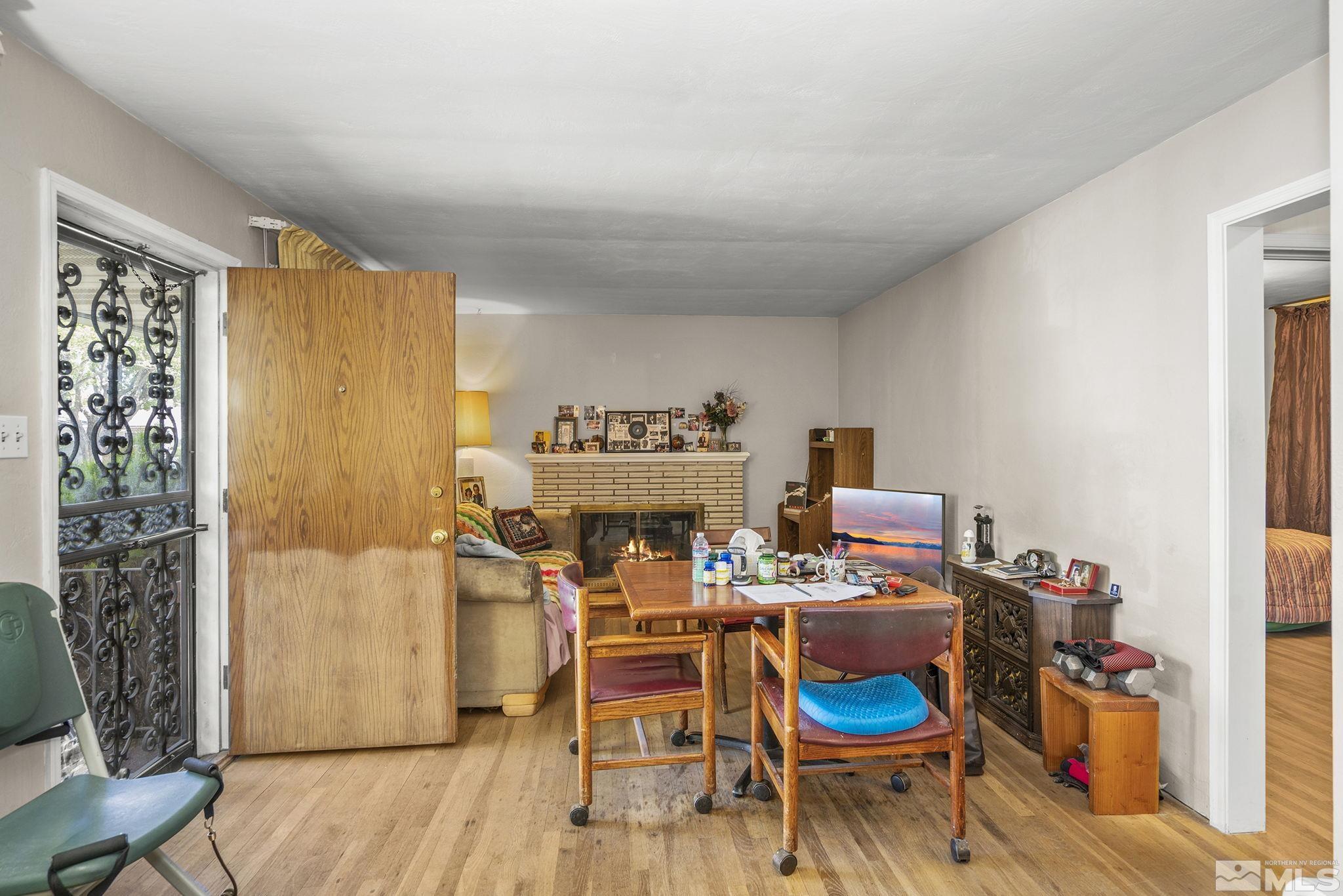 655 Belgrave Avenue Reno, NV 89502 - Photo 3 of 17 a dining room with furniture and wooden floor